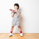 Six year old boy wearing doggie print set