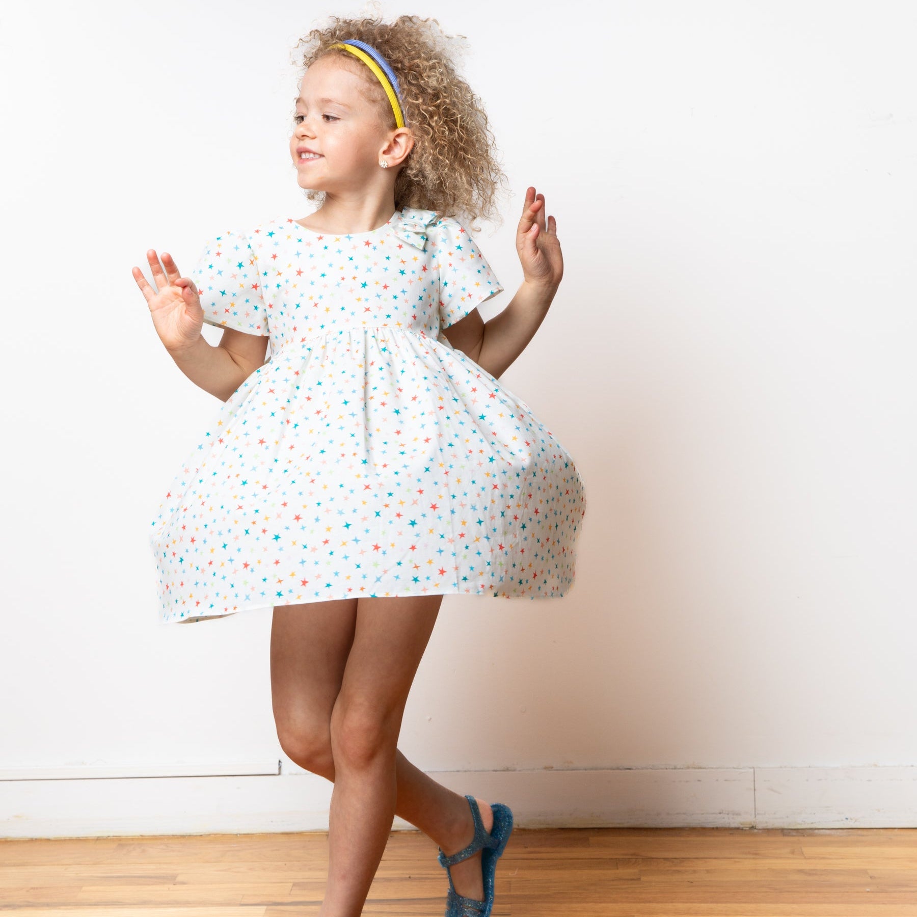 girl wearing star pattern dress