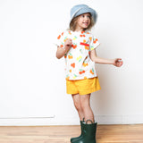 girl wearing yellow shorts