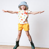 Girl wearing yellow shorts