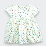 Children's dress with colorful star pattern on a light gray background