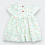 Children's dress with colorful star pattern on a light background