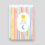 Greeting Card:Welcome to the World darling baby. Featuring illustrations of vertical multicolor stripes and a sun and a moon.
