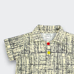 Little Moony Beige Polo Shirt showing the Fine Crosshatch Design and Colored Buttons - Detailed View