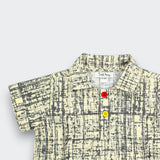 Little Moony Beige Polo Shirt showing the Fine Crosshatch Design and Colored Buttons - Detailed View