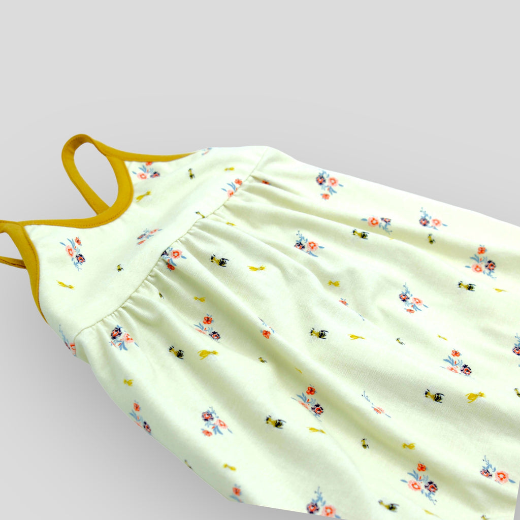 Yellow Floral Bug Strappy Jumpsuit. Side detail view.