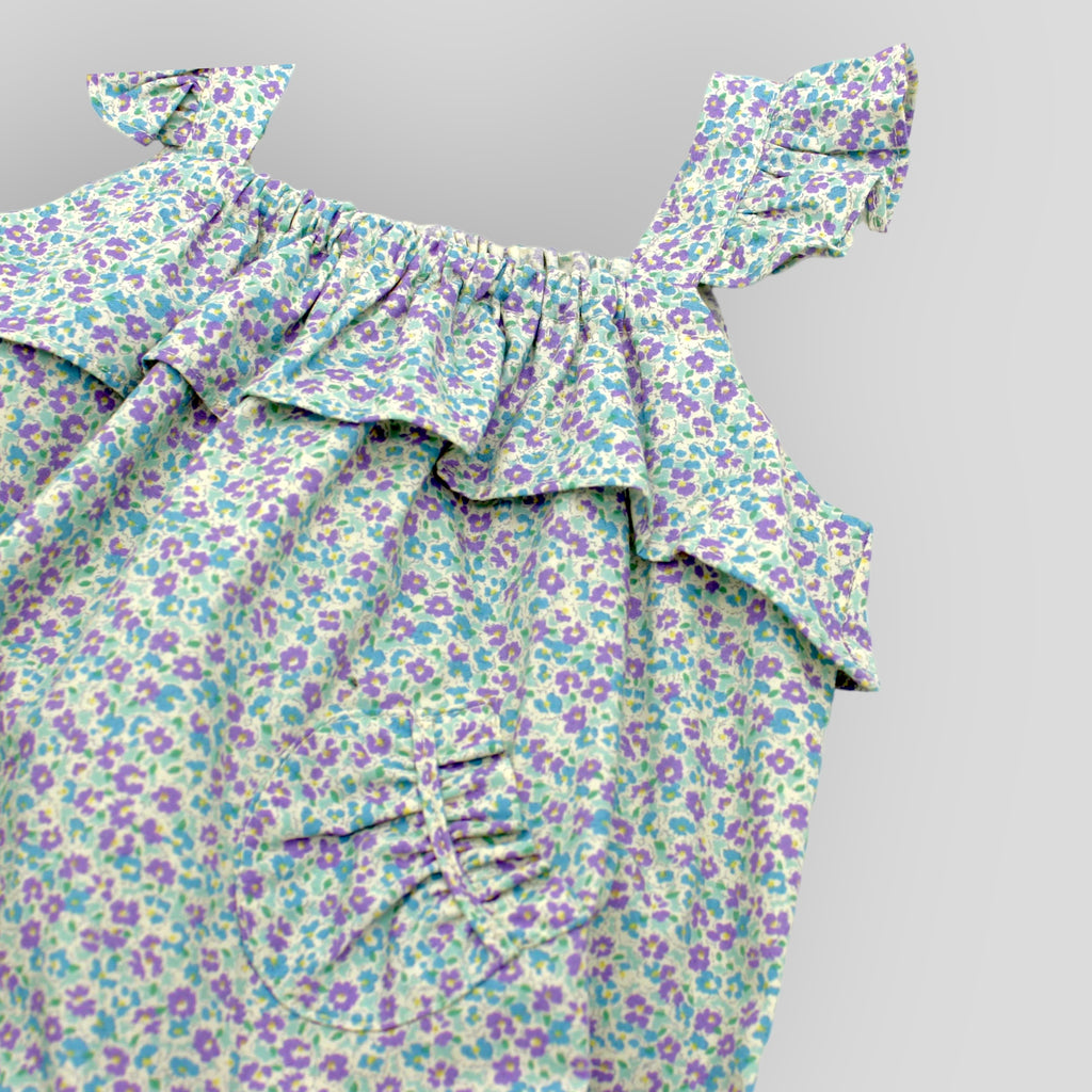 Blue Cotton Petite Fleur Bubble Romper for Baby Girls. Detail view of front pocket.