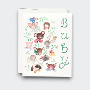 A white baby greeting card with “Baby” written vertically in green, surrounded by watercolor woodland animals including a rabbit, mouse, hedgehog, fox, and puppy. A white envelope sits behind it.