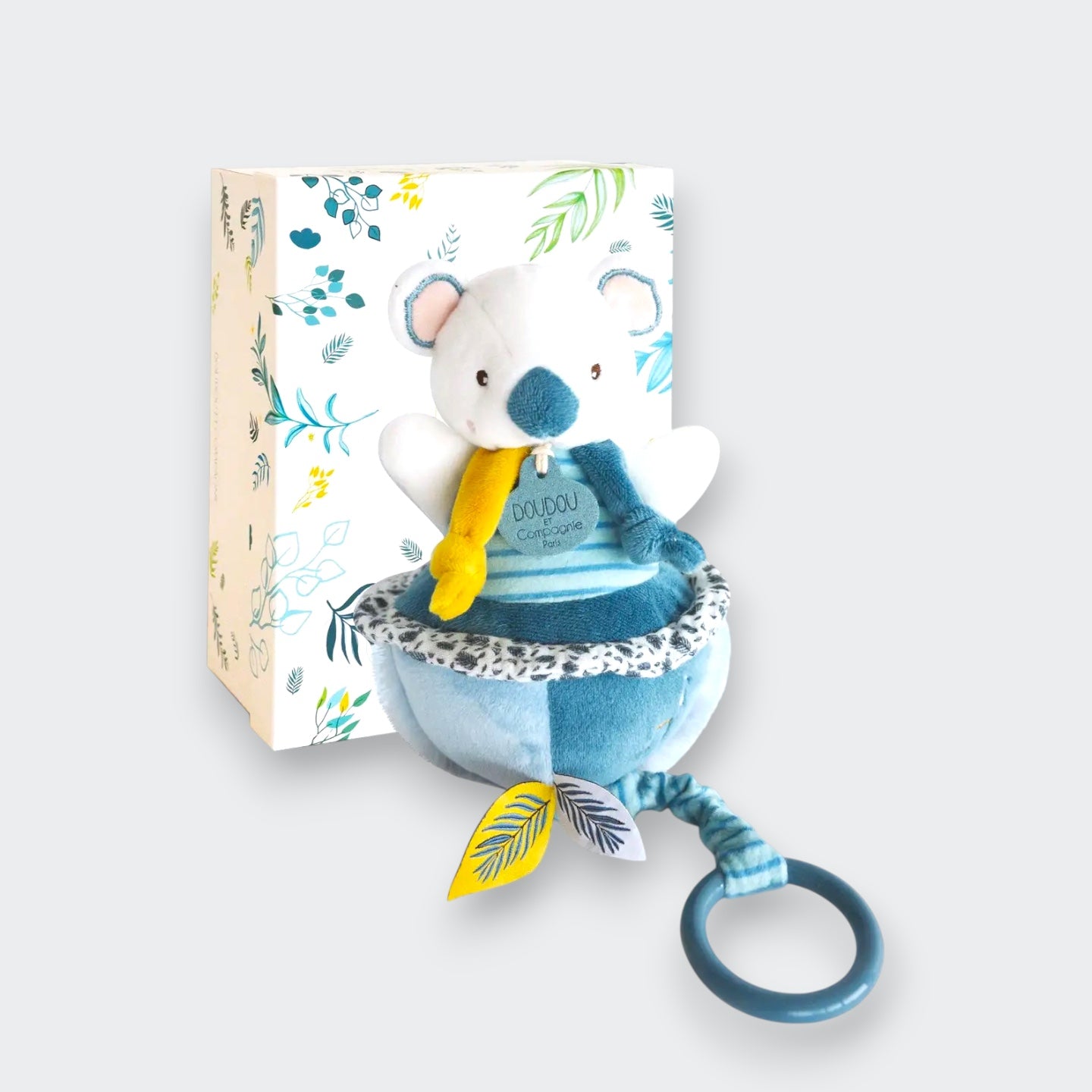 Doudou et Compagnie Yoka the Koala Musical Pull Toy – soft plush koala in teal and white with yellow pull cord and ring, shown with botanical gift box