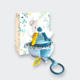 Doudou et Compagnie Yoka the Koala Musical Pull Toy – soft plush koala in teal and white with yellow pull cord and ring, shown with botanical gift box