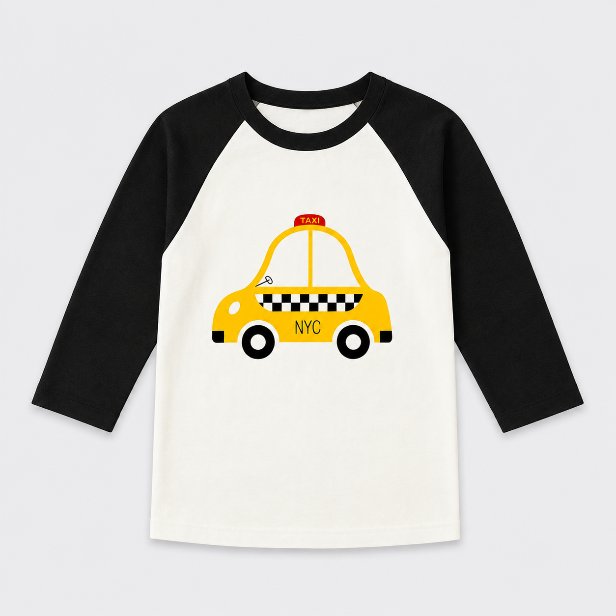 A children's raglan long-sleeve shirt with black sleeves and a white body, featuring a graphic of a yellow NYC taxi on the front.