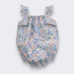 A baby bubble romper with a delicate multicolor floral print in shades of blue, purple, pink, and green on a light background. It features ruffled shoulder straps, a ruffled chest detail, and a ruffled hem, shown against a plain light gray background.