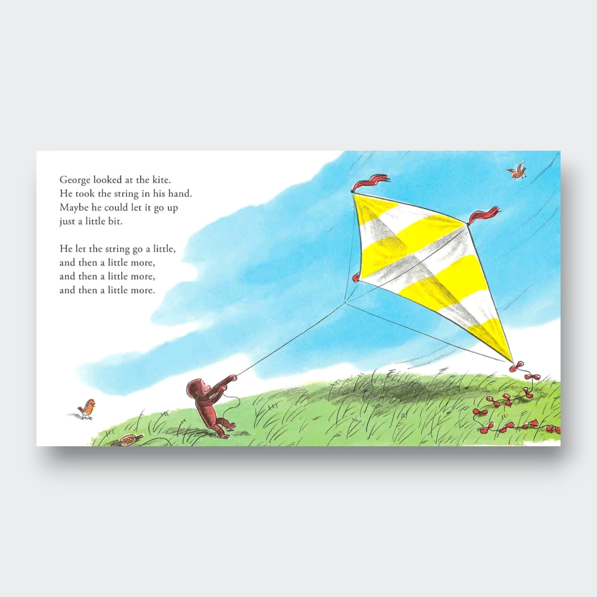 Book titled 'My First Curious George' with colorful design for children. Sample page. Monkey holding a kite.