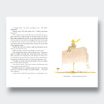 Little Moony The Little Prince Deluxe Edition children's classic book about friendship, imagination, and kindness for young readers and families. Sample page, boy sitting on a wall.