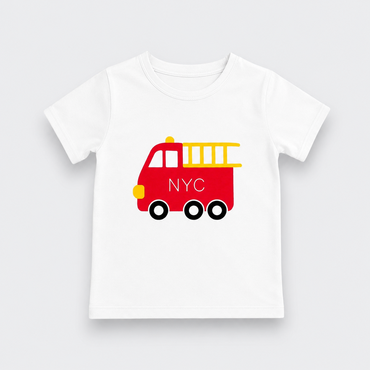 A white kids' short-sleeve t-shirt with a red fire truck graphic on the chest. The fire truck is decorated with a yellow ladder, yellow bumper, a yellow light, and the letters 'NYC' in white on the side.
