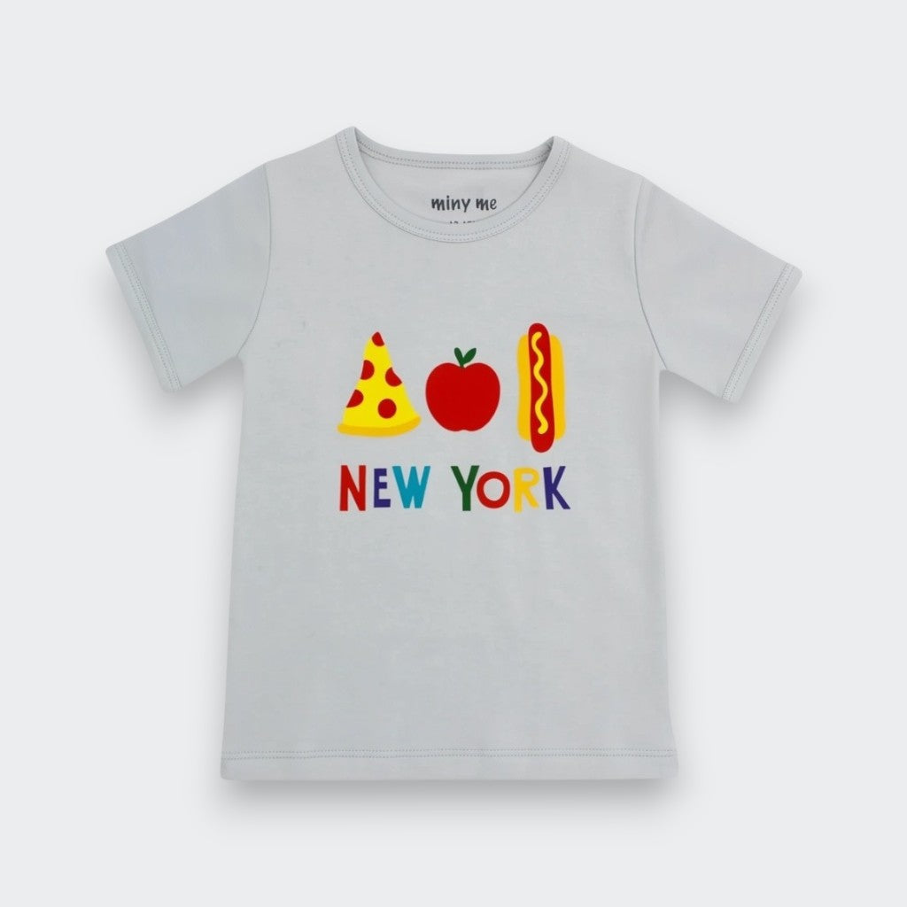 A light gray short-sleeve baby t-shirt featuring a colorful graphic of a pizza slice, an apple, a hot dog, and the text 'NEW YORK' below it. The brand name 'minny me' is printed inside the collar.