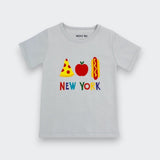 A light gray short-sleeve baby t-shirt featuring a colorful graphic of a pizza slice, an apple, a hot dog, and the text 'NEW YORK' below it. The brand name 'minny me' is printed inside the collar.