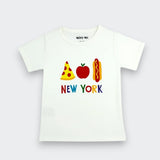 A white short-sleeve baby t-shirt with a colorful graphic of a pizza slice, an apple, and a hot dog spelling 'NEW YORK' on the chest, shown against a light gray background.