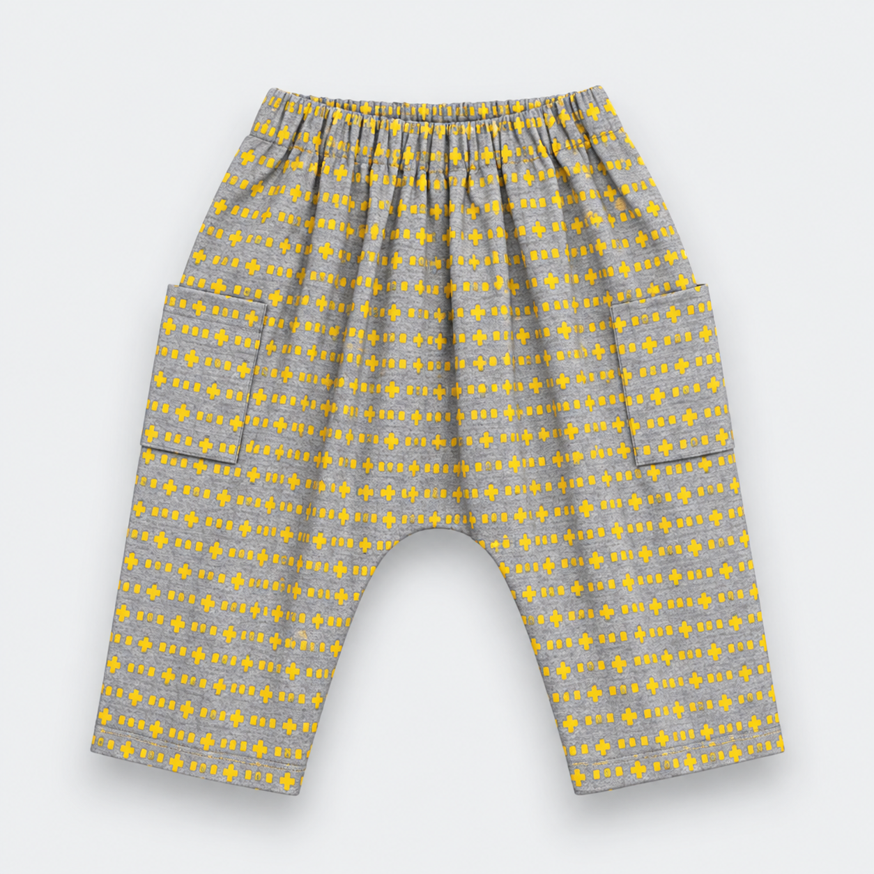 Gray and yellow patterned baby pants with an elastic waistband and side pockets, shown flat on a light gray background.