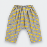 Gray and yellow patterned baby pants with an elastic waistband and side pockets, shown flat on a light gray background.
