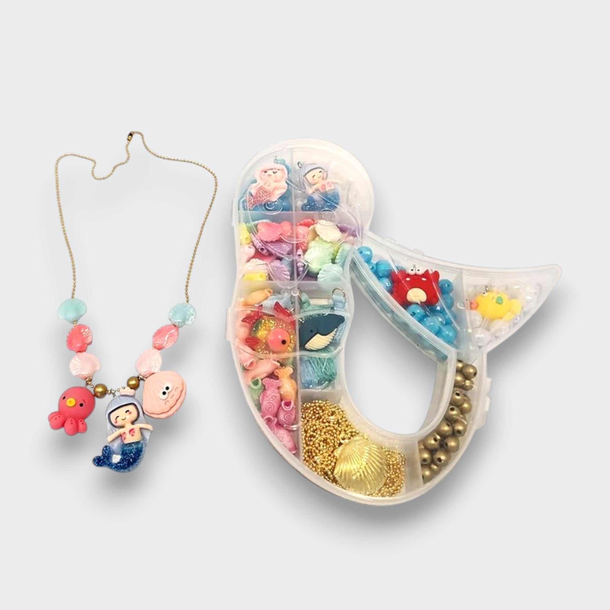 Little Moony Magical Mermaid Jewelry Charm DIY Kit with mermaid charms and colorful beads for children to create bracelets and necklaces.