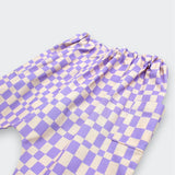  Close of Little Moony lavender and cream checker print harem pants for baby and toddler with patch pockets and elastic waist on white background