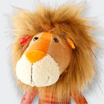 Little Moony Patchwork Plush Lion with colorful fabrics and a fluffy mane for babies and toddlers. Close up view.
