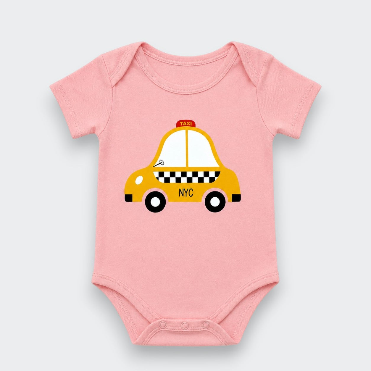 A light pink baby bodysuit featuring a cartoon graphic of a yellow NYC taxi with black and white checkered details, displayed on a light gray background.