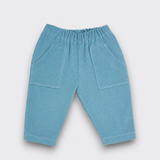 Blue corduroy pants with two front pockets for babies and toddlers.