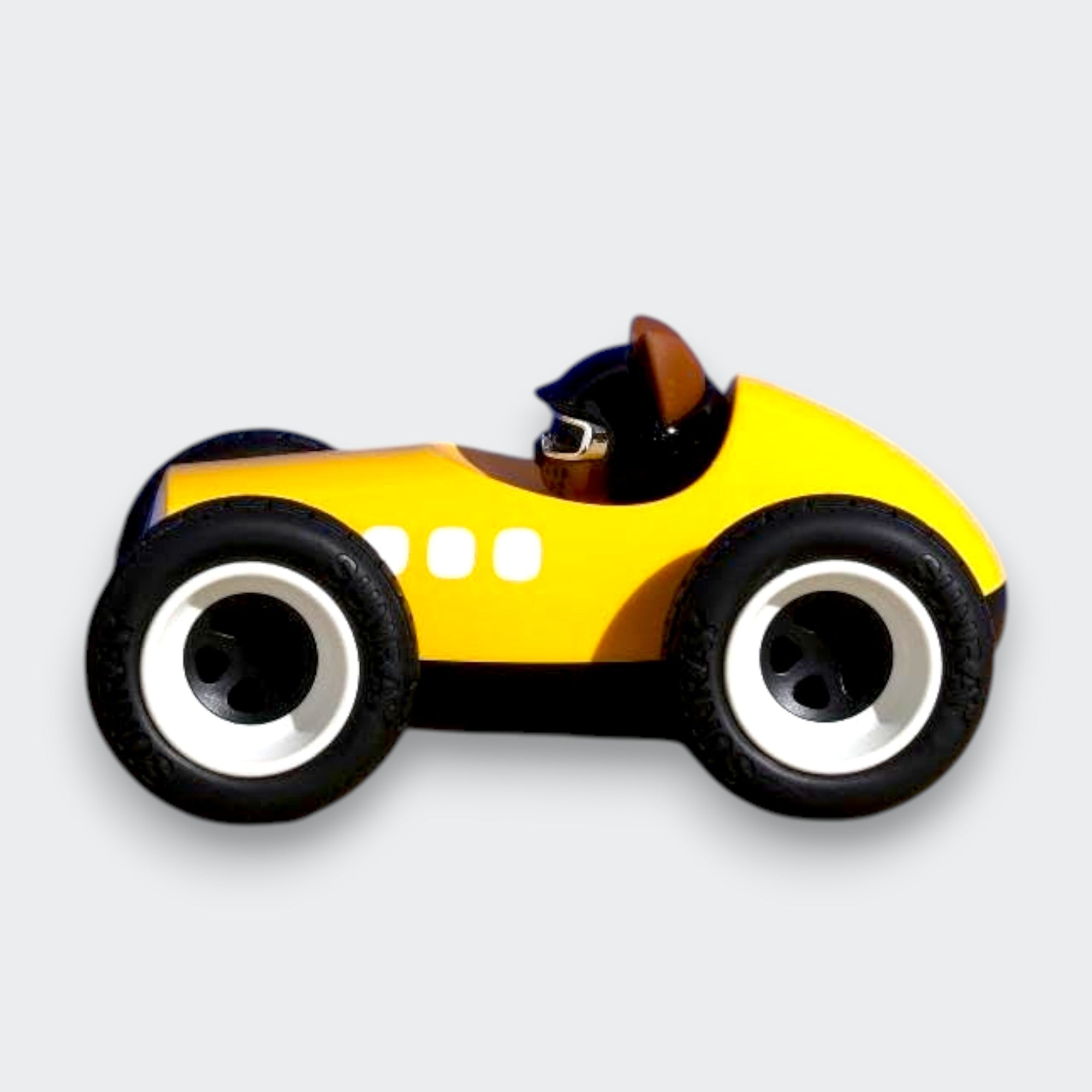 Little Moony Egg Roadster Yellow toy car with a classic roadster design for imaginative play and young vehicle enthusiasts. Side view.