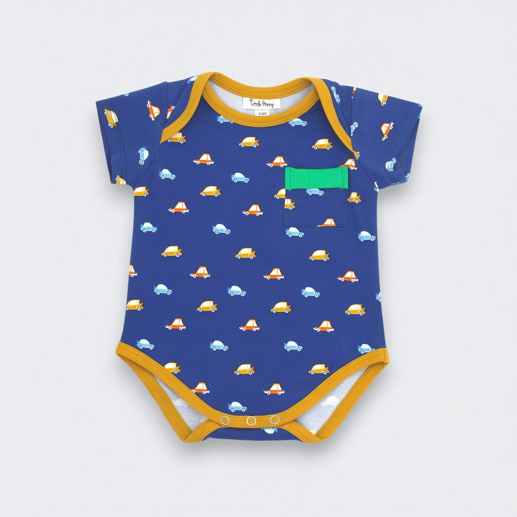 aby bodysuit in navy blue cotton knit with all-over car print, mustard yellow trim, and green chest pocket accent