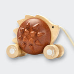 Little Moony Pull-Along Hedgehog wooden toy with a gentle chime for babies and toddlers. Facing right view.