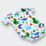 Baby romper with colorful dinosaur pattern on a white background