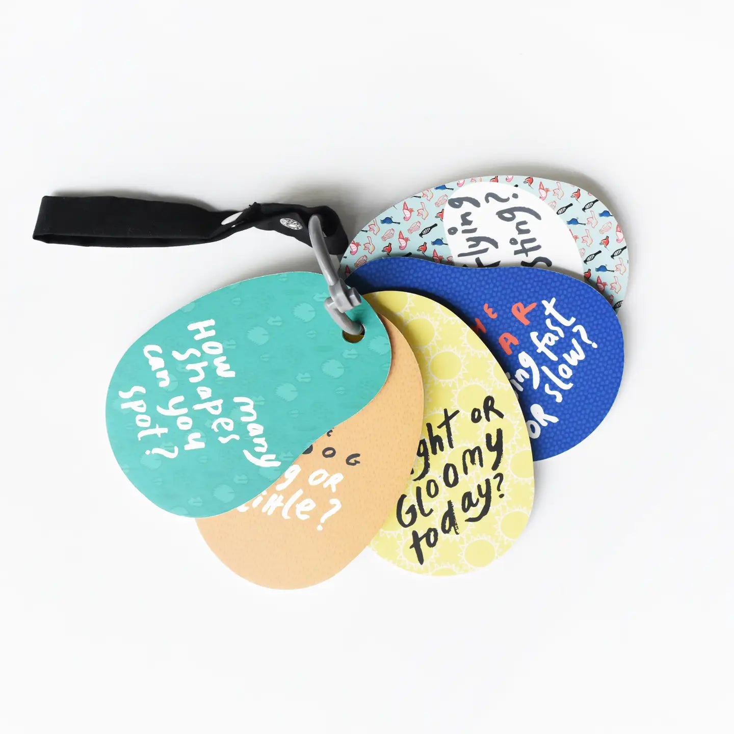 Colorful round tags with humorous text on a white background. Little Moony