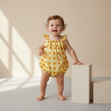 Baby girl wearing Little Moony Watermelon Romper, handmade baby clothes designed in NYC