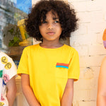 Six year old boy wearing Yellow Tee
