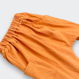 Little Moony Cotton knit jogger pants in sienna brick color showing fine knit fabric and stitching for kids and babies - Close up view