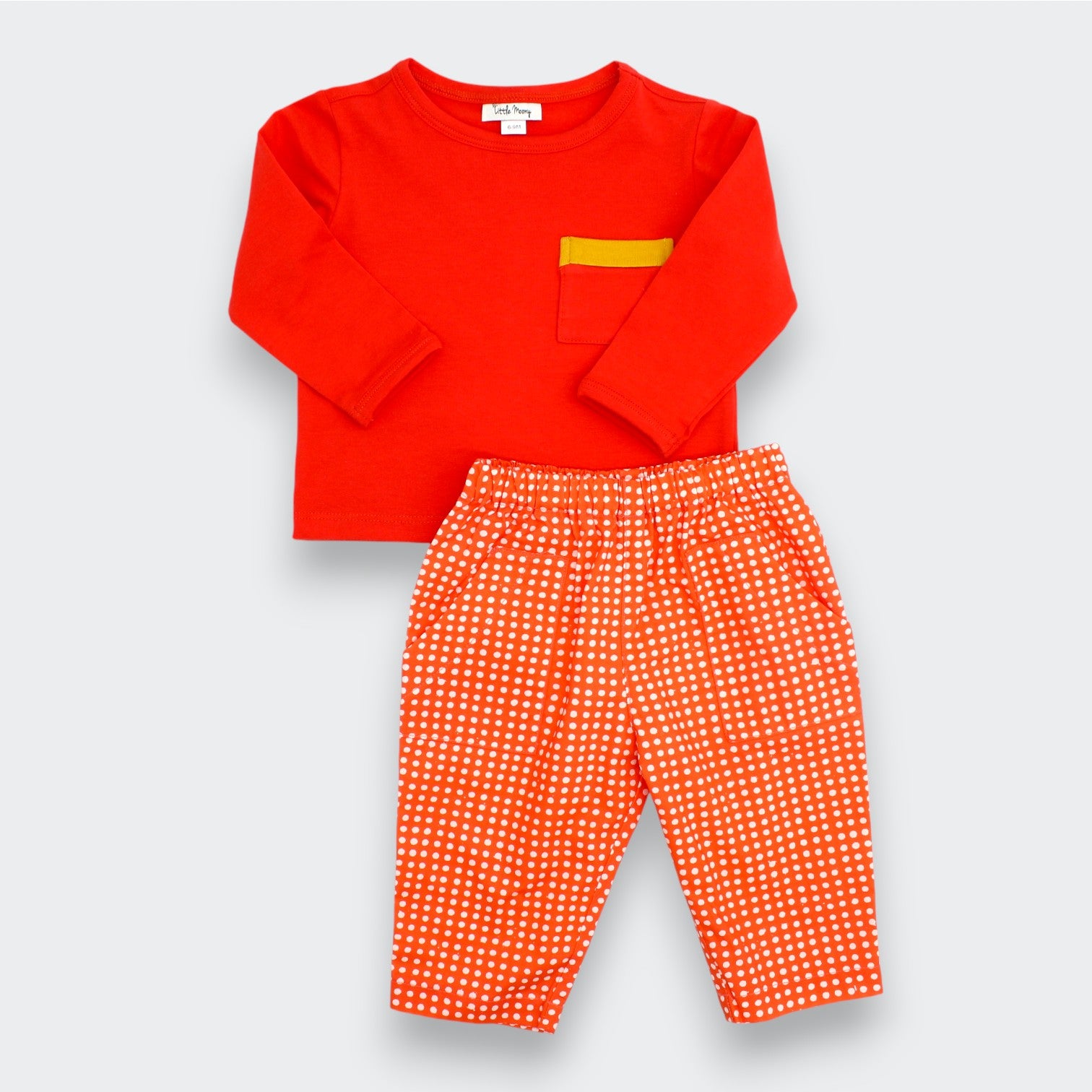 Little Moony cherry red polka dot baby pants styled with a red top