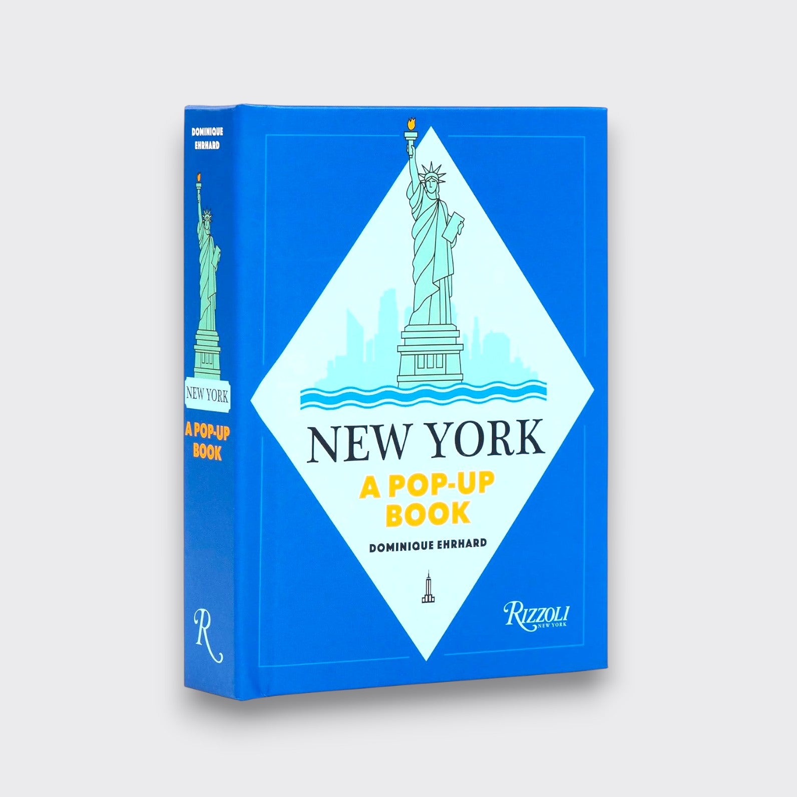 New York: A Pop-Up Book by Dominique Ehrhard, showing its blue cover with a Statue of Liberty illustration on a light gray background.