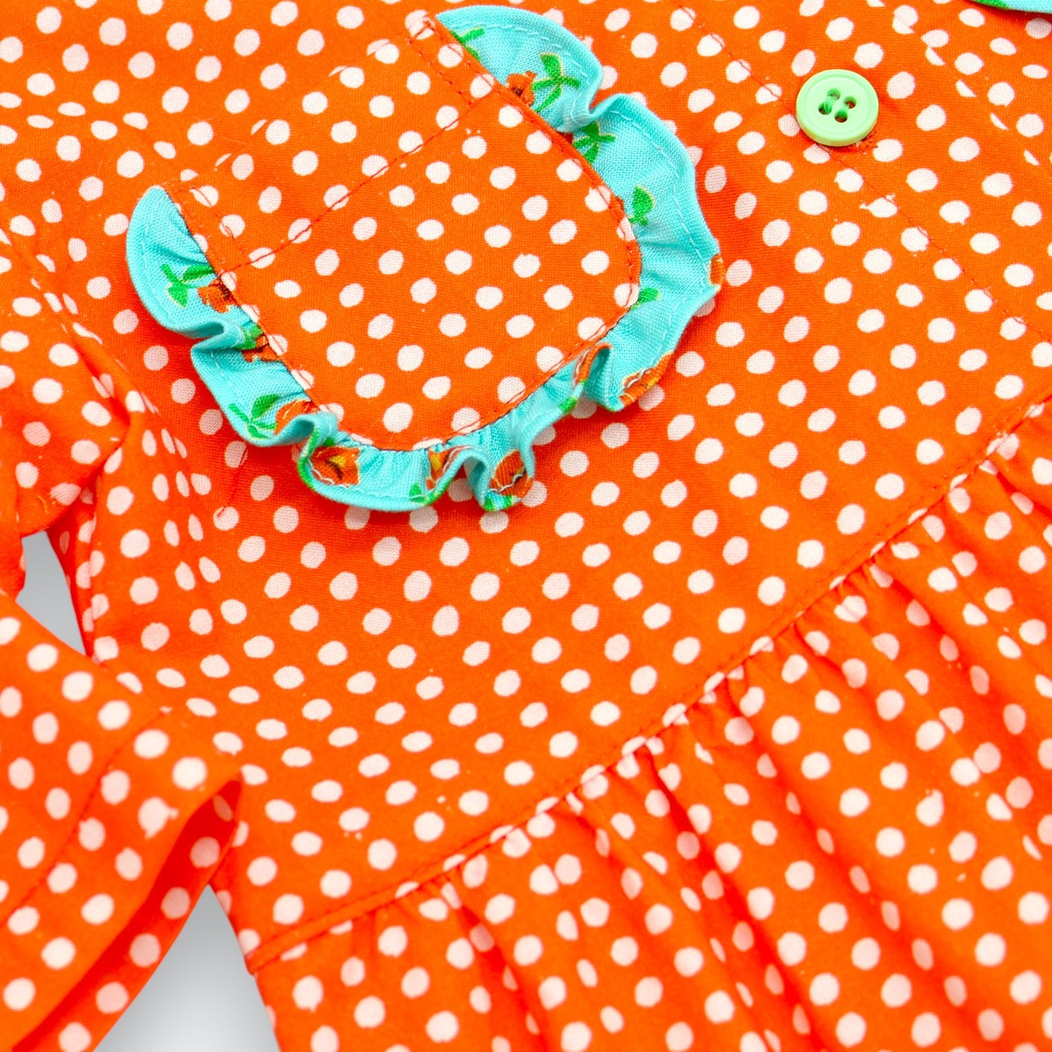 Little Moony Cherry dot cotton ruffle pocket romper for babies and detailed view