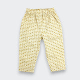 Little Moony cream and brown cross-stitch print cotton baby and toddler pants flat lay view