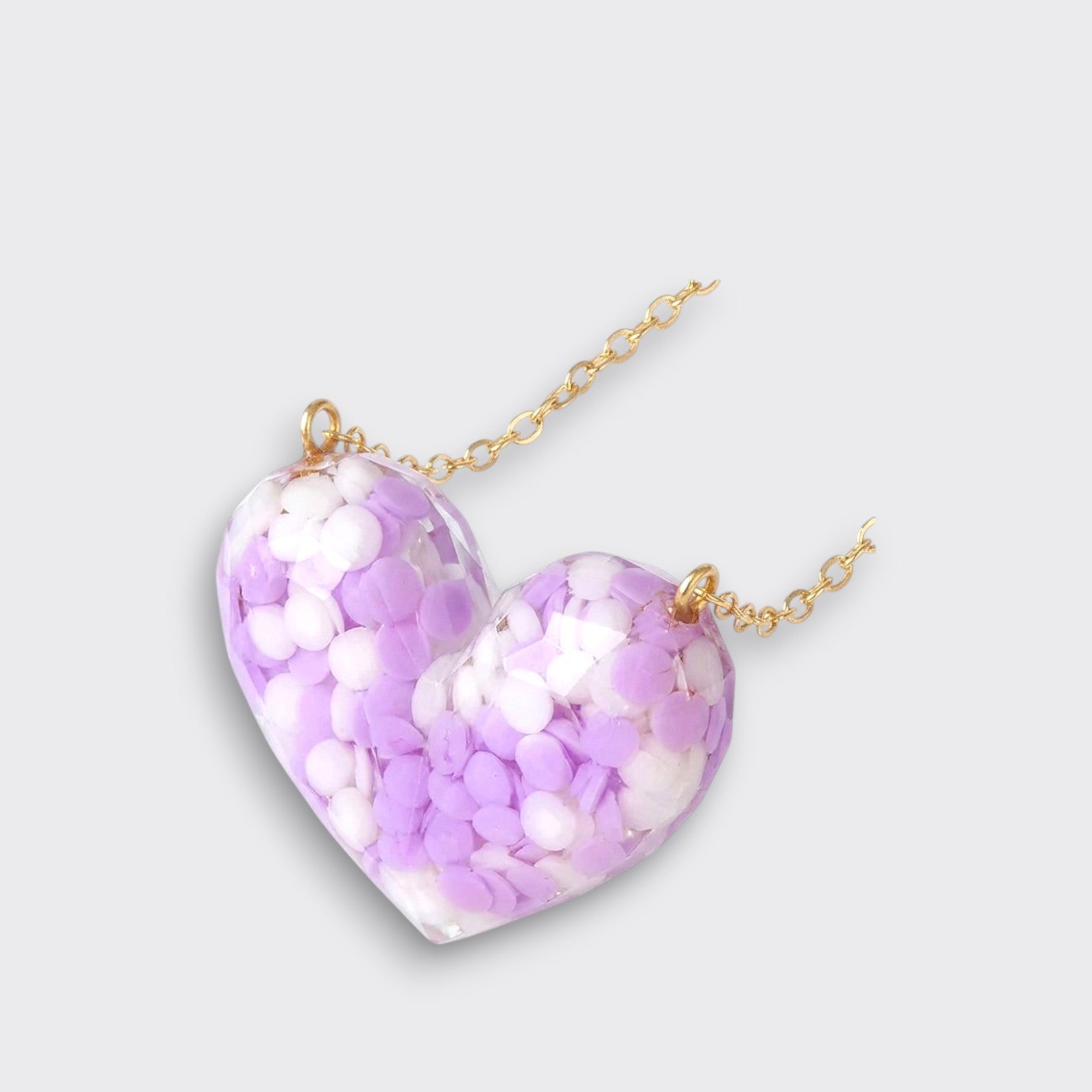 Little Moony Dotty Heart Necklace in Purple with confetti-filled resin heart and gold chain for kids side view