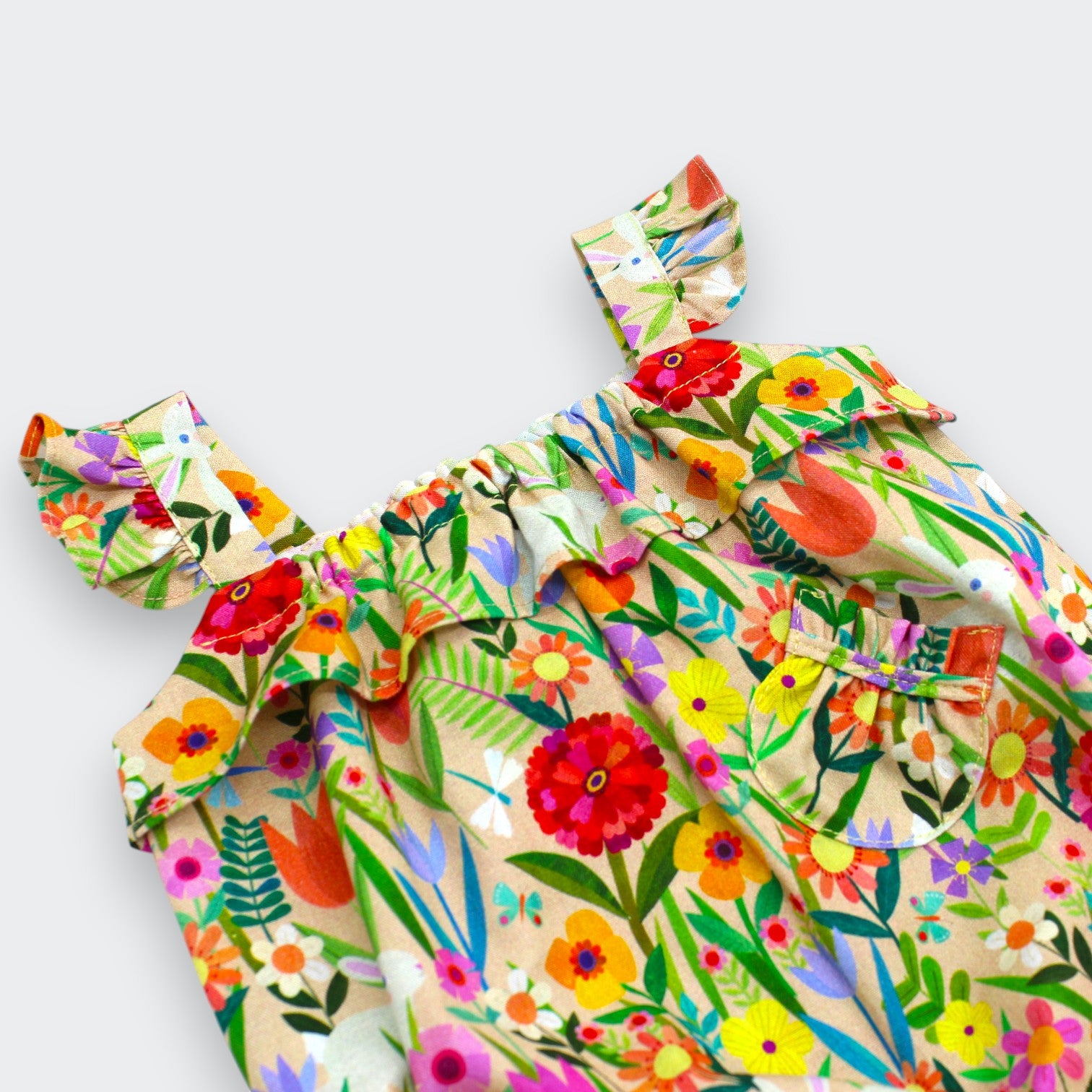 Close-up of ruffle strap and gathered neckline on Little Moony Bunny and Floral Baby Romper