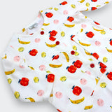 Close-up of apple banana and peach print with patch pocket detail on Little Moony