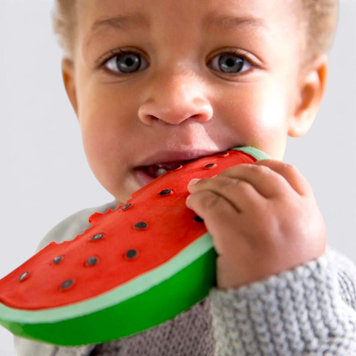Little Moony Fruit Salad Newborn Pack with natural rubber watermelon with a boy biting the teether