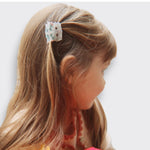 Little Moony Small Hair Claw in colorful multi designs for girls ages 3 and up worn by a little girl