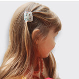 Little Moony Small Hair Claw in colorful multi designs for girls ages 3 and up worn by a little girl
