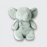Straight-on view of a soft mint elephant plush toy with wide ears, a curled trunk, and a silver bow on a light gray background.