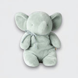 Straight-on view of a soft mint elephant plush toy with wide ears, a curled trunk, and a silver bow on a light gray background.