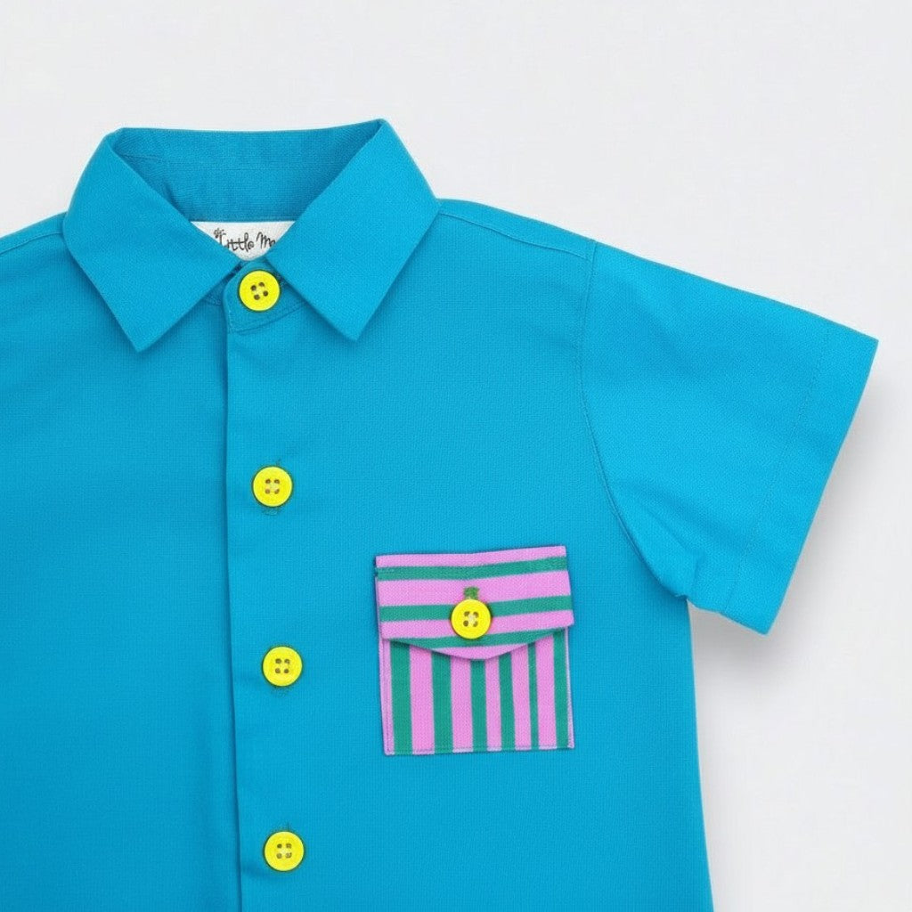 Blue shirt with colorful buttons and a striped pocket on a white background